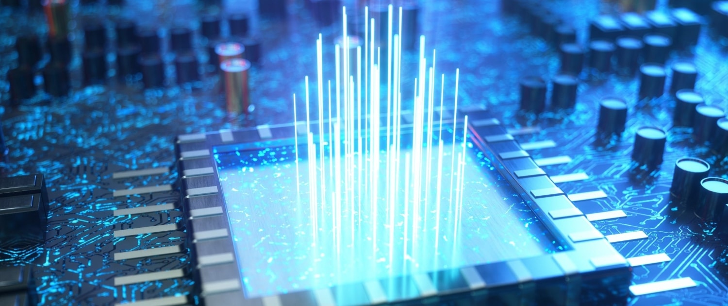 shutterstock_1342400177-scaled-e1725523468556 A large square on a circuit board with a blue color overlay. Beams of light of varying heights are coming up from the center of the square